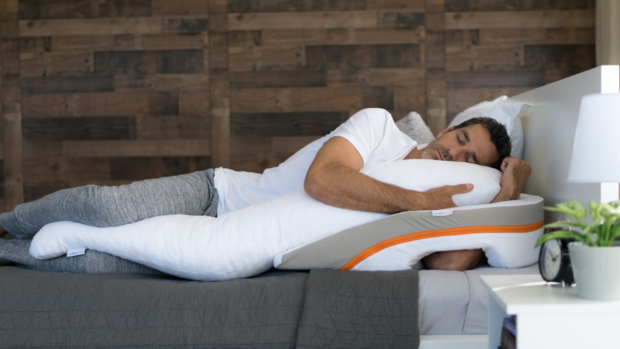 man sleeping on the MedCline relfux relief system for positional therapy